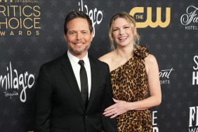 Scott Wolf in a black suit posing with Kelley Wolf in a cheetah-print dress, posing at the Critics Choice Awards
