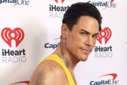 Tom Sandoval in a yellow tank top at an iHeartRadio event