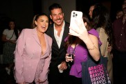 Brittany Cartwright and Jax Taylor taking a selfie with a fan at BravoCon