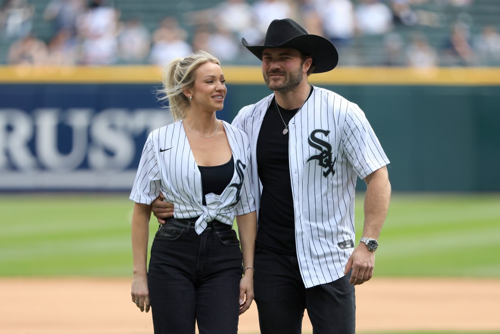 Steven McBee Jr and Calah Jackson posing together at a baseball game, wearing White Sox jerseys