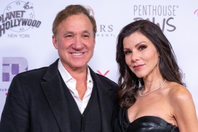 Dr. Terry Dubrow and Heather Dubrow wearing black and posing together on a red carpet
