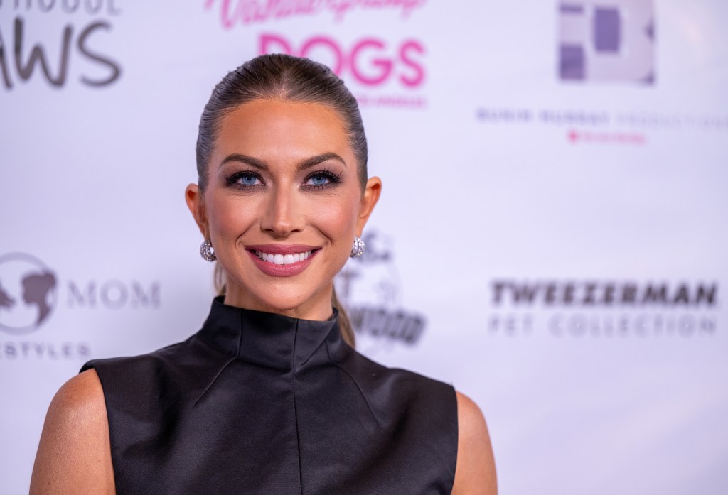 Stassi Schroeder in a black dress at a Vanderpump Dogs event
