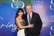 Hilaria Baldwin in a black and white dress posing with Alec Baldwin, who is wearing a black suit, at the American Ballet Theatre