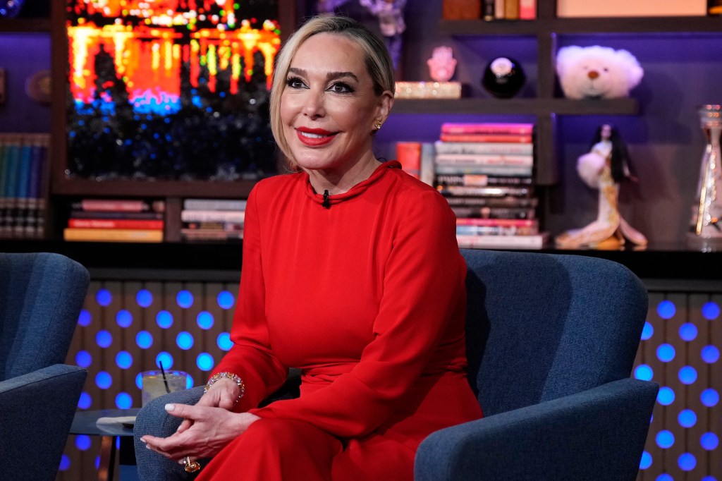 A grinning Marysol Patton wearing red during an appearance on Watch What Happens Live