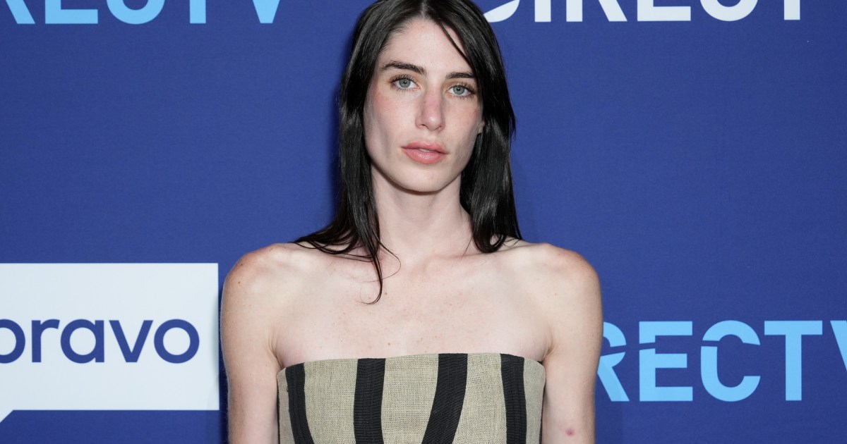 Georgia McCann in a beige and black striped dress at a DIRECTV event