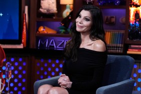 Heather Dubrow in a black dress on Watch What Happens Live, tilting her head and giving a side eye