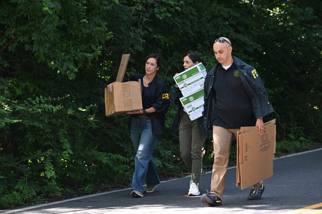 FBI agents leaving John Bolton's home with cardboard boxes