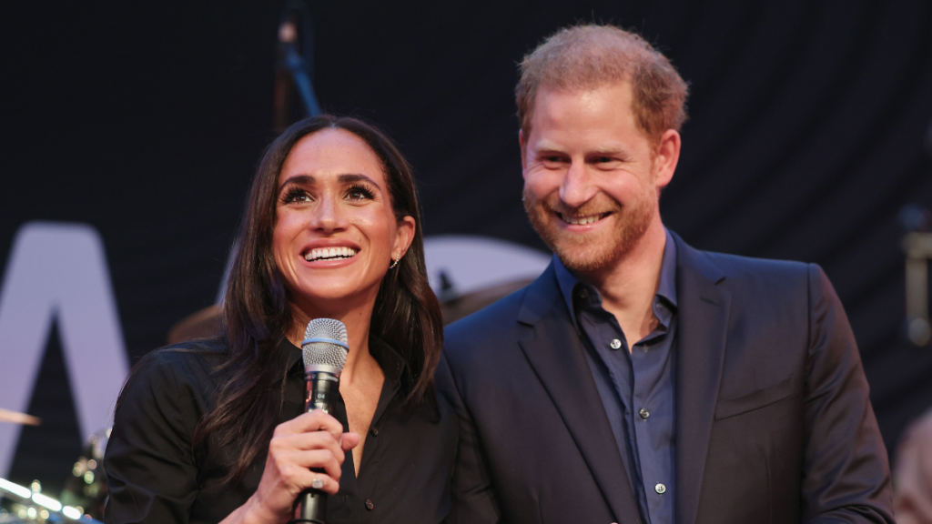 Prince Harry, Duke of Sussex and Meghan, Duchess of Sussex on stage
