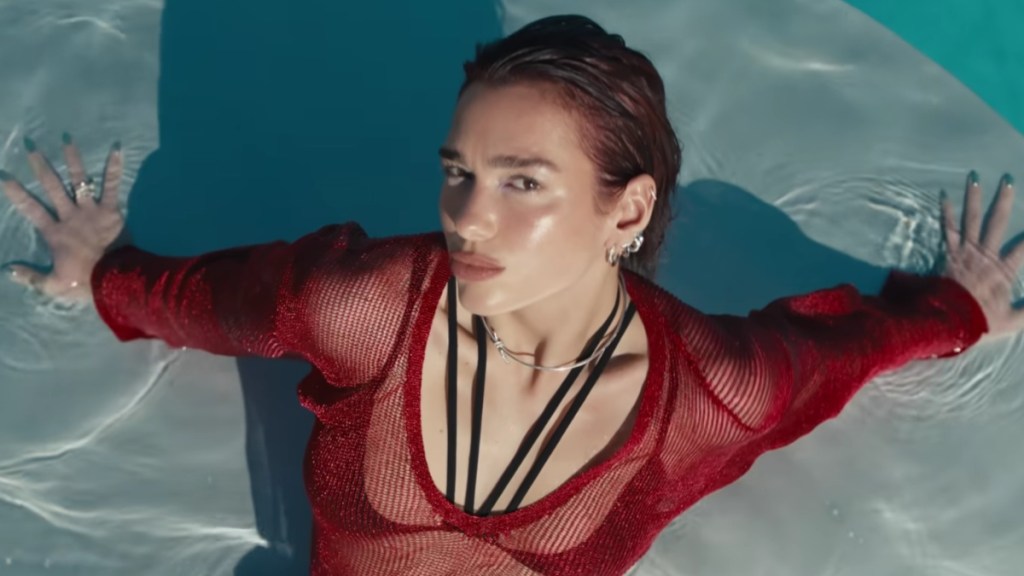 Dua Lipa Flaunts Her Curves In High-Slit Silver Dress
