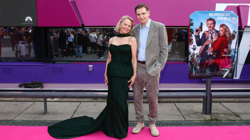 Pamela Anderson and Liam Neeson attend "The Naked Gun" German Premiere aboard "The Pioneer" at Anlegestelle John-Foster-Dulles-Allee on July 24, 2025, in Berlin, Germany.