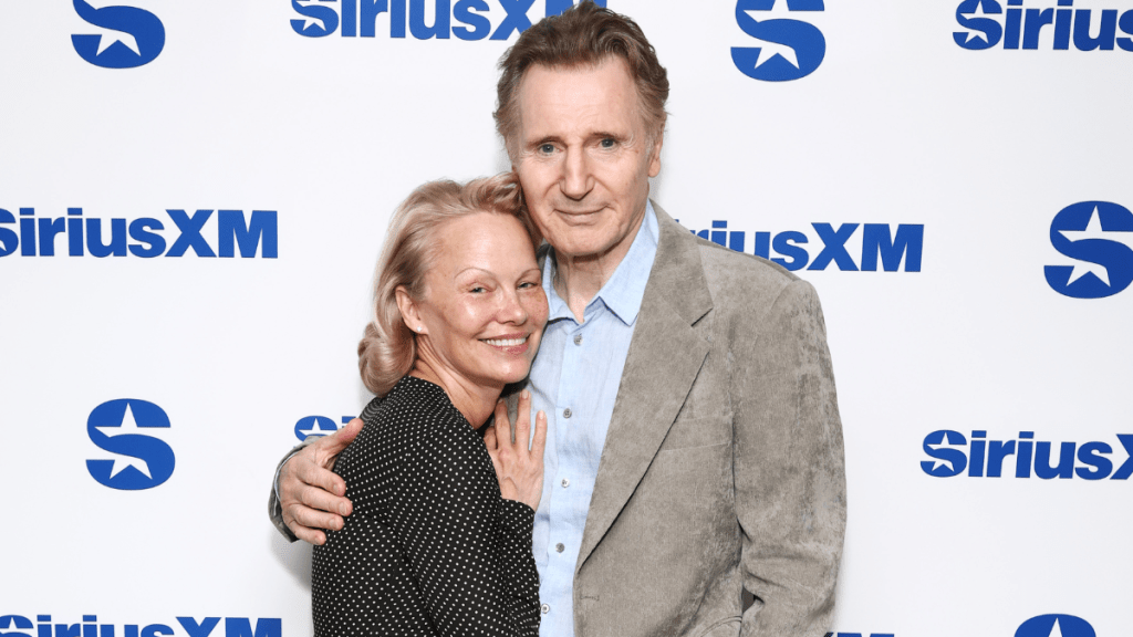 Pamela Anderson and Liam Neeson attend SiriusXM's Town Hall with the cast of "The Naked Gun" hosted by Andy Cohen at SiriusXM Studios on July 30, 2025 in New York City.