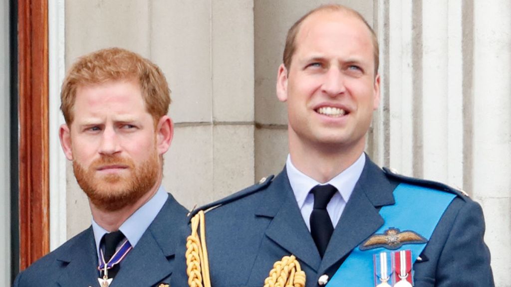 Prince Harry, Duke of Sussex and Prince William, Duke of Cambridge watch a flypast to mark the centenary of the Royal Air Force from the balcony of Buckingham Palace on July 10, 2018 in London, England.