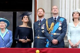 Queen Elizabeth II, Meghan, Duchess of Sussex, Prince Harry, Duke of Sussex, Prince William, Duke of Cambridge and Catherine, Duchess of Cambridge watch the RAF flypast on the balcony of Buckingham Palace, as members of the Royal Family attend events to mark the centenary of the RAF on July 10, 2018 in London, England.