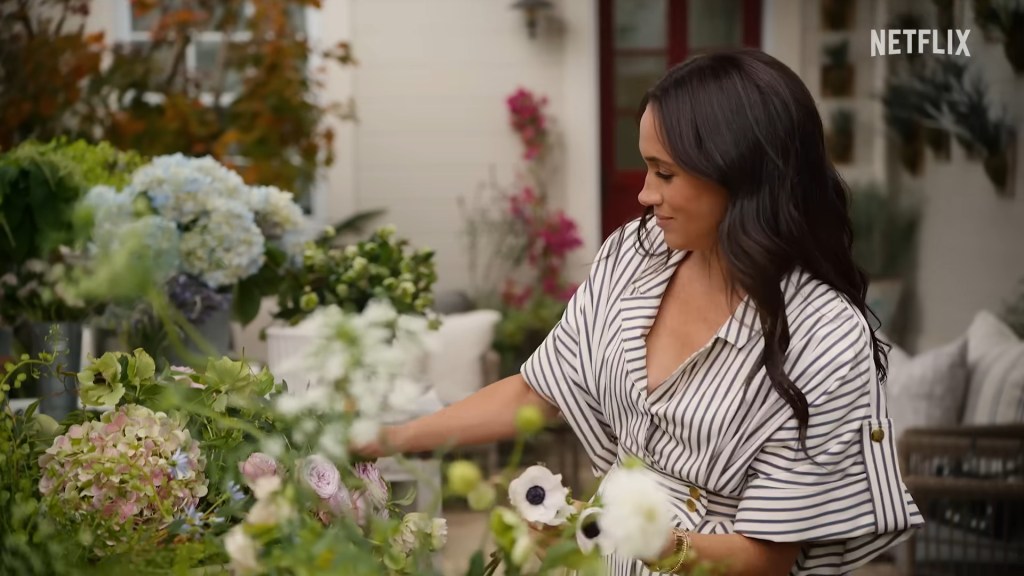 Meghan Markle picking flowers in a garden on With Love, Meghan