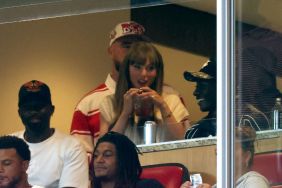 Travis Kelce #87 of the Kansas City Chiefs and fiance Taylor Swift watch from a suite during the first half of the game between the Cincinnati Bearcats and the Nebraska Cornhuskers at Arrowhead Stadium on August 28, 2025 in Kansas City, Missouri