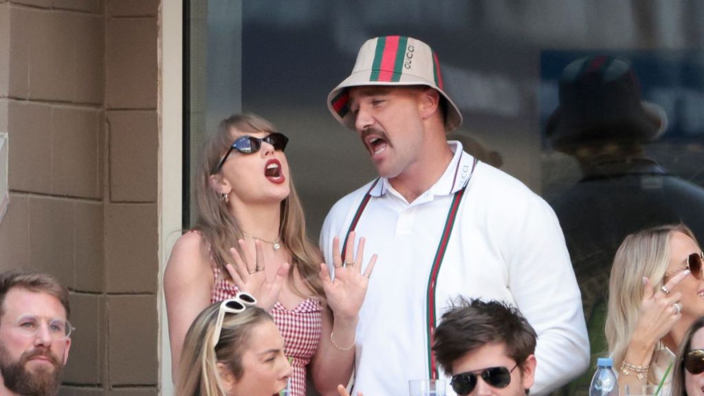 Taylor Swift sings with Travis Kelce during the men's final on day fourteen of the 2024 US Open Tennis Championships at the USTA Billie Jean King Tennis Center on September 8, 2024 in Flushing Meadows, Queens, New York City