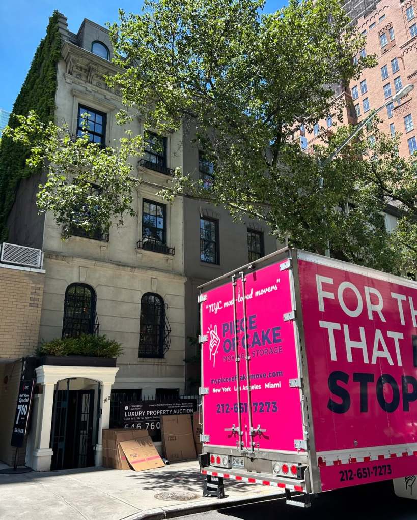 Sonja Morgan's townhome with a pink moving truck outside of it