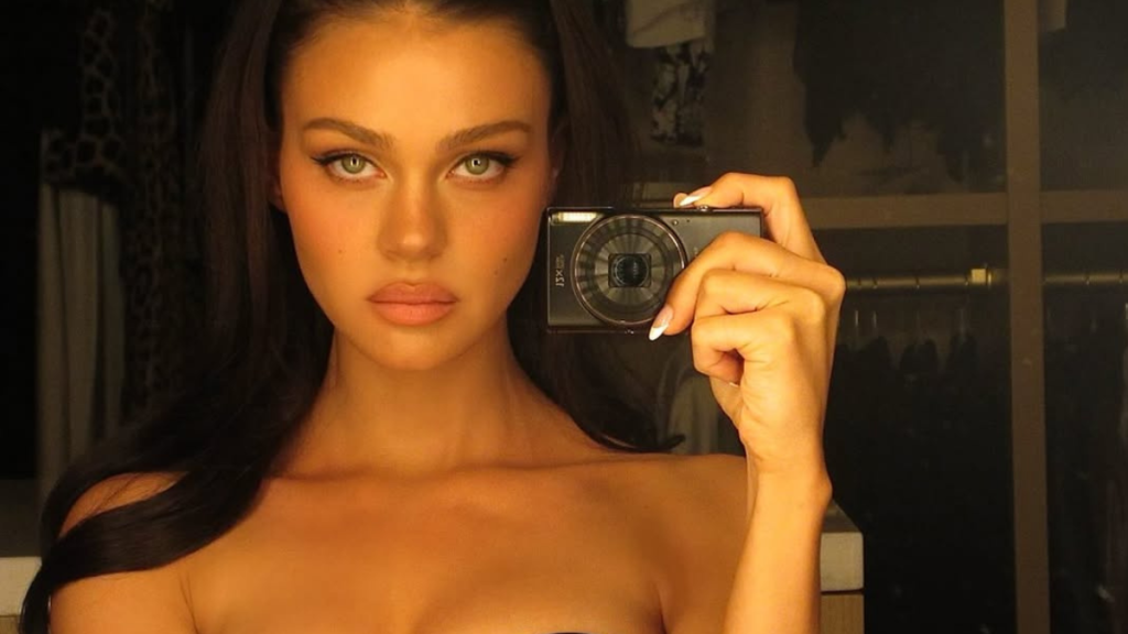 Nicola Peltz plunging corset top photos