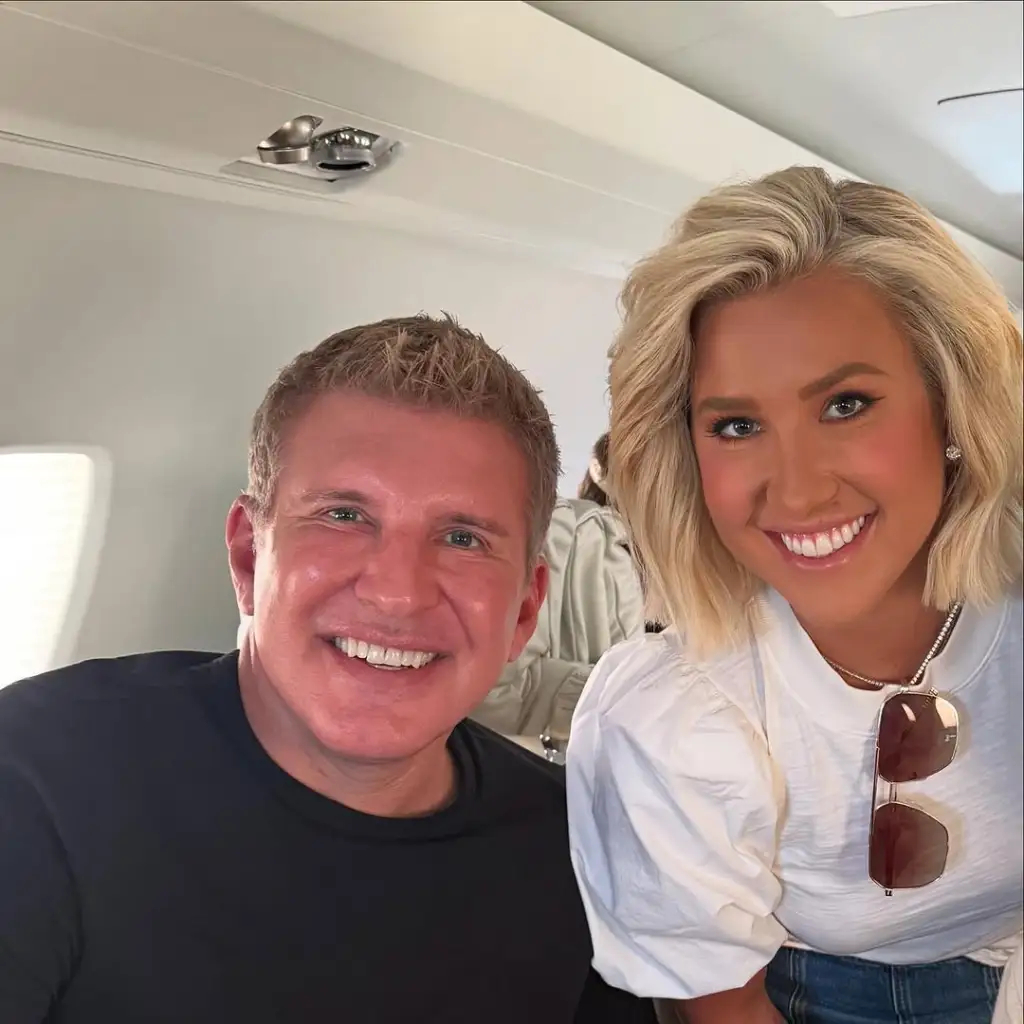 Todd and Savannah Chrisley posing together and smiling in a selfie