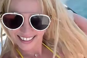 Britney Spears Shows Off Moves in Loose White Dress on a Yacht