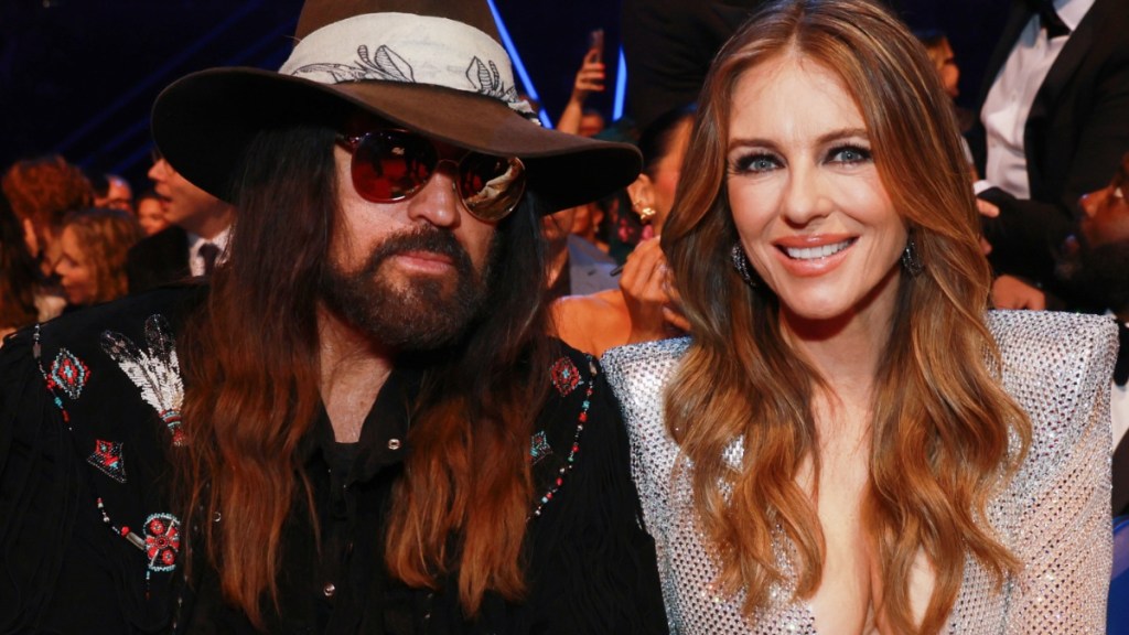 Elizabeth Hurley Opts for Sheer Silver Mesh Dress Alongside Billy Ray Cyrus