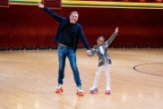 Todd Chrisley and Chloe Chrisley on roller skates