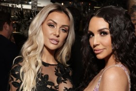 Lala Kent in a black lacy dress posing with Scheana Shay, who is wearing a sparkly purple top