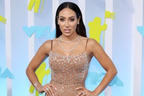 Melissa Gorga with her hands on her hips in a nude jumpsuit at the MTV VMAs