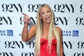 Liv Walker at 92NY wearing a red dress and pointing her finger