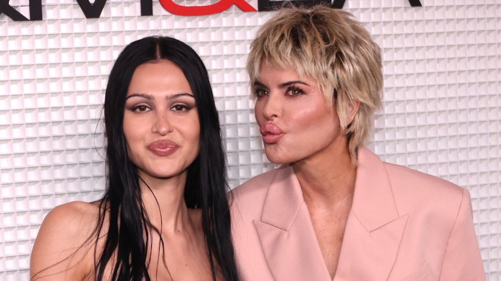 Lisa Rinna in a pink blazer making a kissy face at her daughter, Amelia Gray