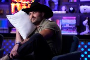 Steven McBee Jr on Watch What Happens Live, resting his head on a pillow