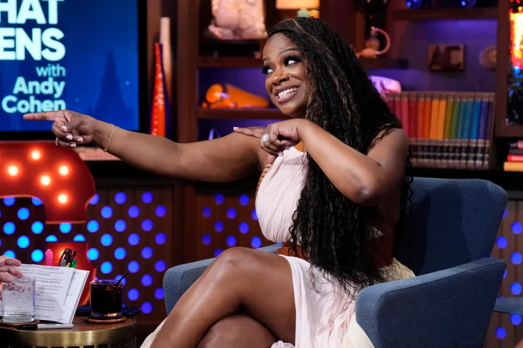 Kandi Burruss on Watch What Happens Live, pointing both hands
