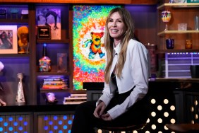 Carole Radziwill in a white jacket sitting next to the bar on Watch What Happens Live