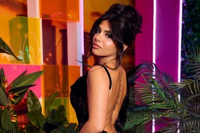 Huda Mustafa in a black dress doing an over the shoudler pose at the Love Island USA reunion