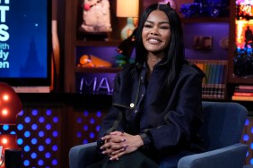Teyana Taylor in a denim outfit smiling on Watch What Happens Live