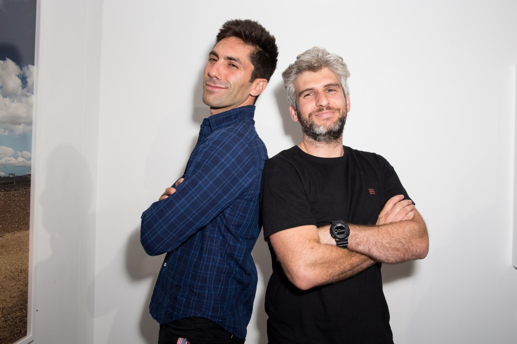Nev Schulman and Max Joseph from Catfish posing with their arms crossed
