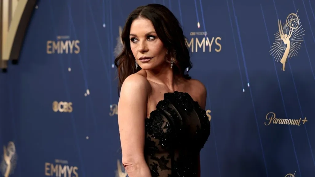 Catherine Zeta-Jones Stuns in Sheer Black Corset Gown with Morticia Addams Flair