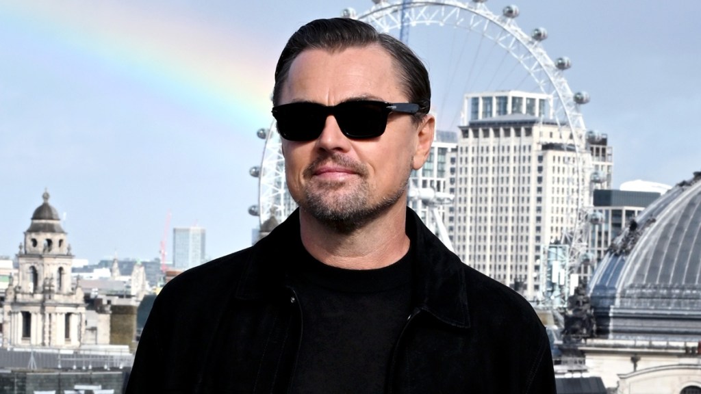 Leonardo DiCaprio Hides Under Baseball Cap During Vittoria Ceretti PDA Moment