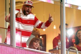 Travis Kelce #87 of the Kansas City Chiefs reacts as fiancee Taylor Swift smiles while watching from a suite during the second half of the game between the Cincinnati Bearcats and the Nebraska Cornhuskers at Arrowhead Stadium on August 28, 2025 in Kansas City, Missouri.