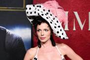 Julia Fox Channels '90s in Corset Dress & Feathered Hat