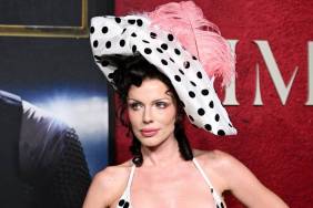 Julia Fox Channels '90s in Corset Dress & Feathered Hat