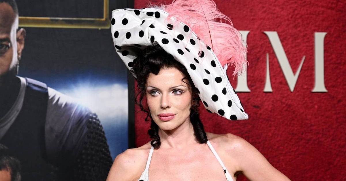 Julia Fox Channels '90s in Corset Dress & Feathered Hat
