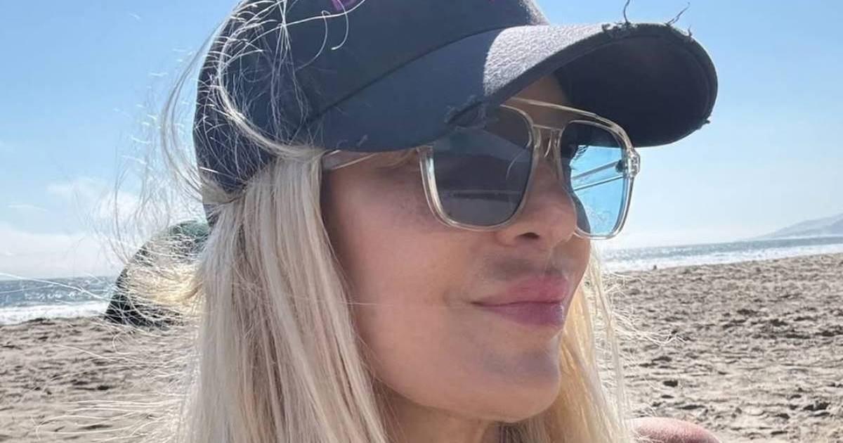 Tori Spelling Highlights Her Curves in Green Bikini Top