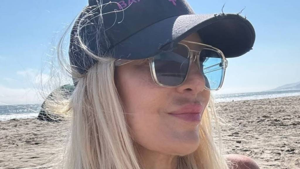 Tori Spelling Highlights Her Curves in Green Bikini Top