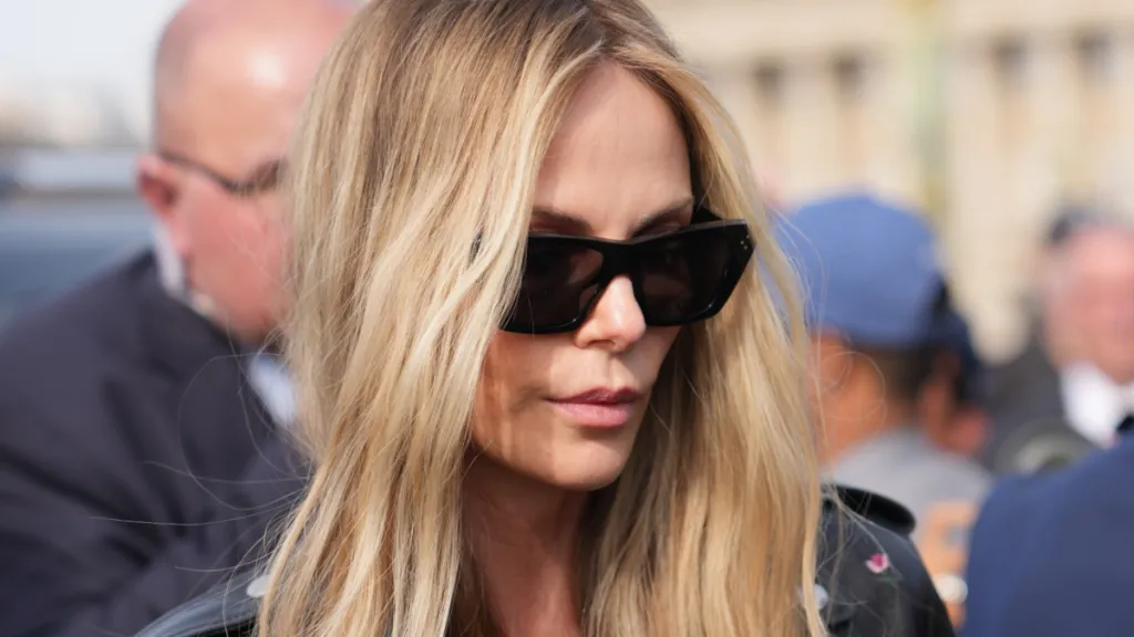 Charlize Theron Walks Past Johnny Depp at Dior Event