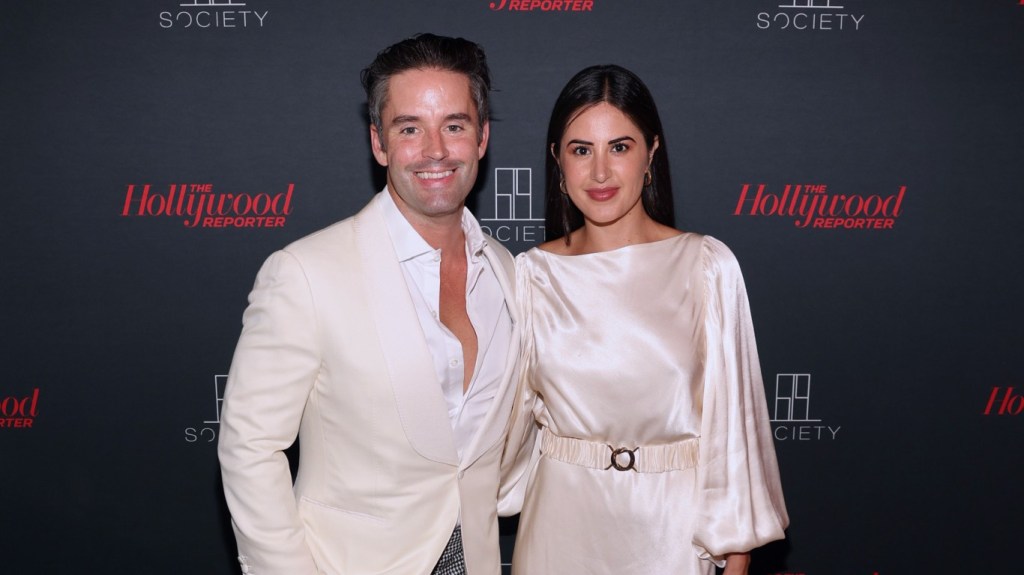 Michelle Saniei and Jesse Lally wearing white at a Hollywood Reporter event