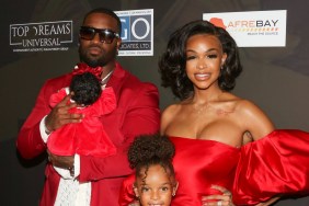 Masika Kalysha and her family on a red carpet, dressed in red