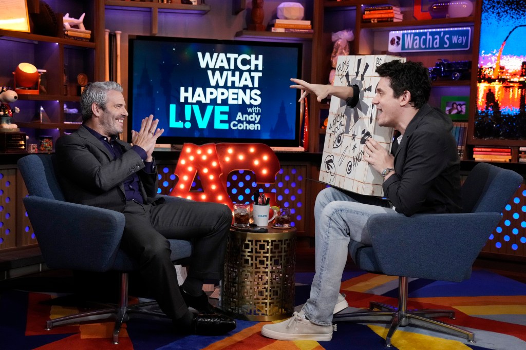 John Mayer sticking his hand through a glory hole on Watch What Happens Live with Andy Cohen