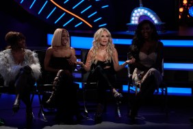 Tamra Judge at BravoCon sitting among a bunch of Housewives with a spotlight on her