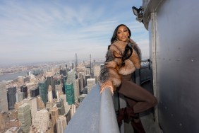 Porsha Williams in a brown fur jacket at the top of the Empire State Building